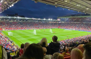 View across the Old Trafford pitch towards the Sir Bobby Charlton Stand and Stretford End.
